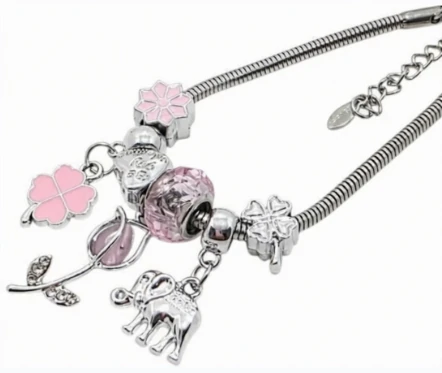 Pulsera de acero quirurgico con dijes fantasia rosa 18cm + 4cm